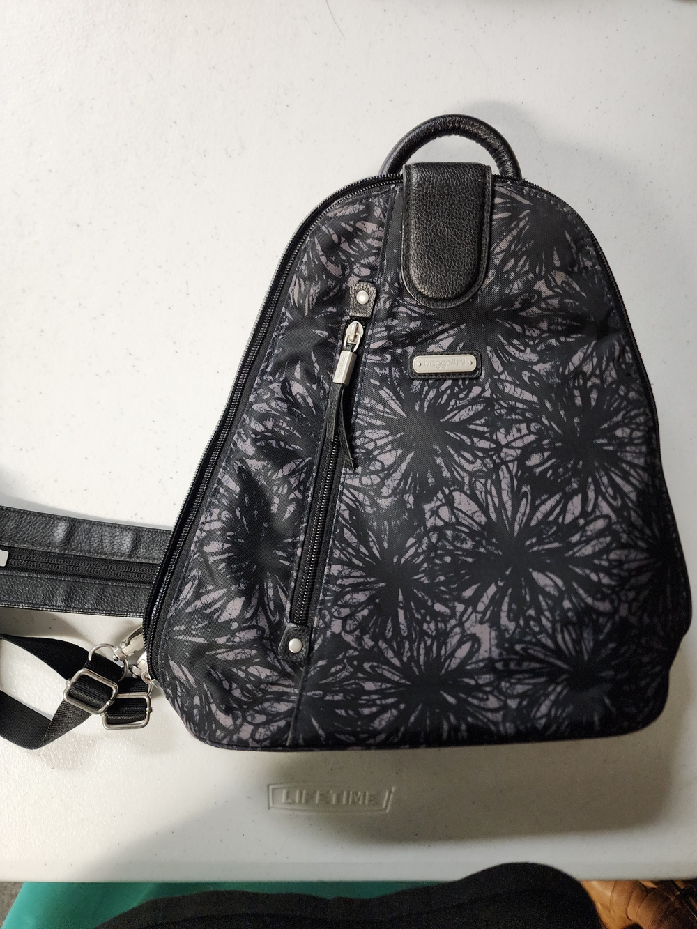 Baggallini Metro Black Floral Sling Backpack - Modern Everyday Carry